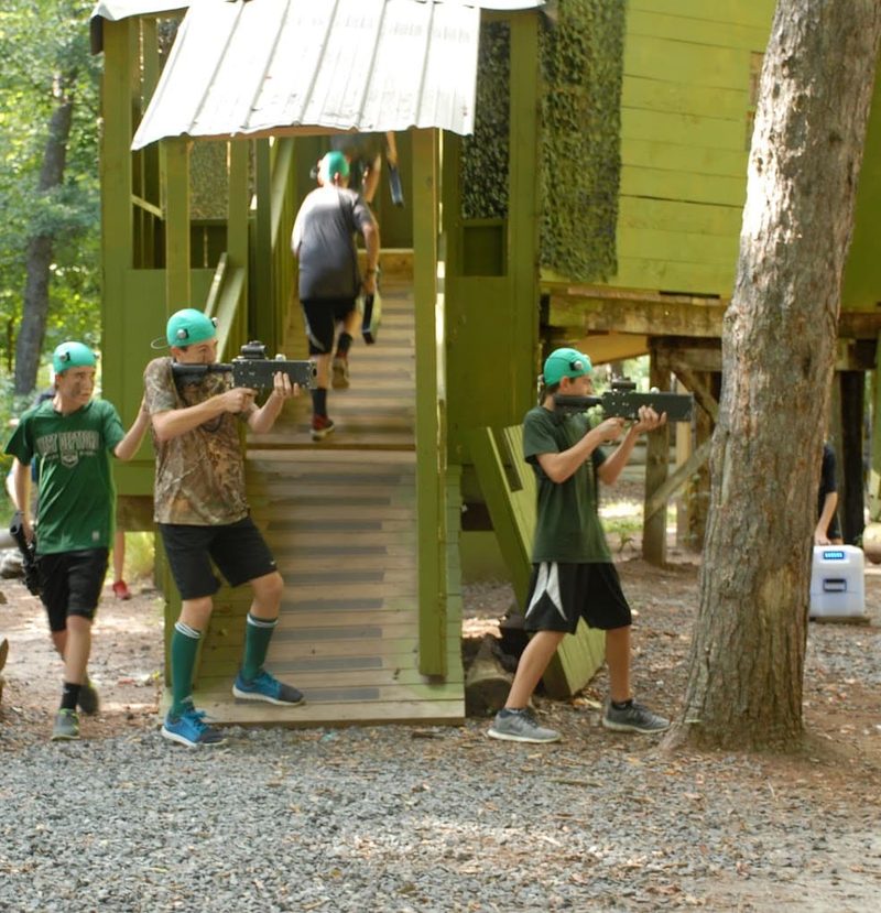 Players taking cover during a laser tag game at Cousins Adventure Parks