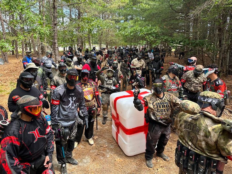 A large-scale paintball scenario game in progress at Cousins Adventure Parks